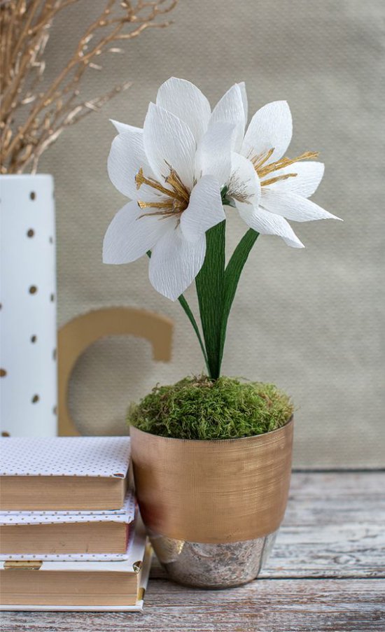 Paper flowers in a pot on the table