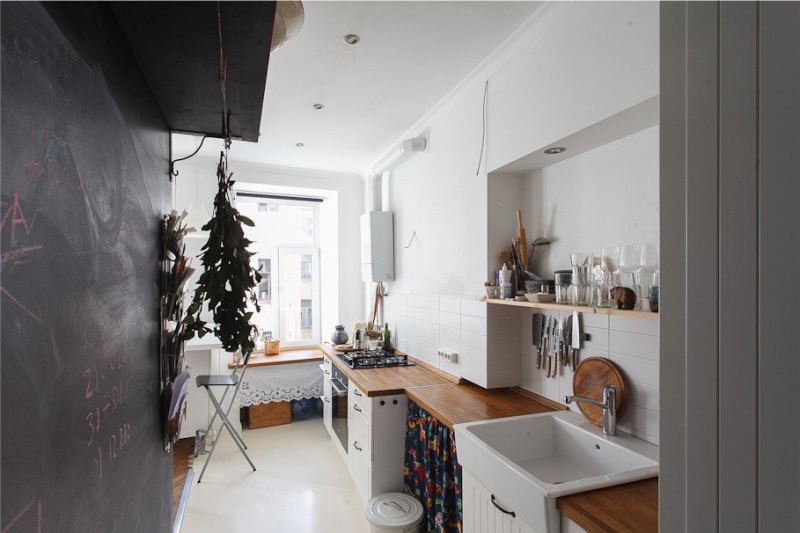 Geyser in the interior of the kitchen with white walls