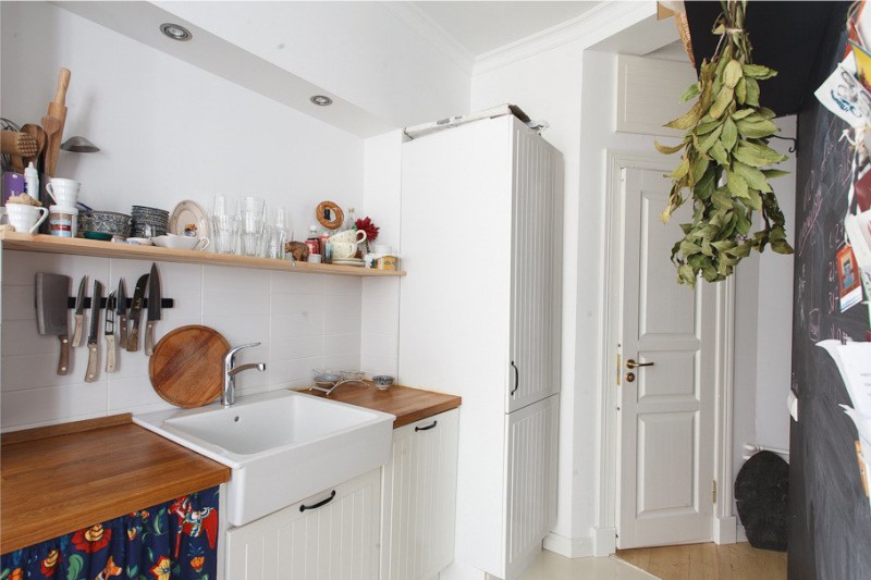 Geyser in the interior of the kitchen with white walls