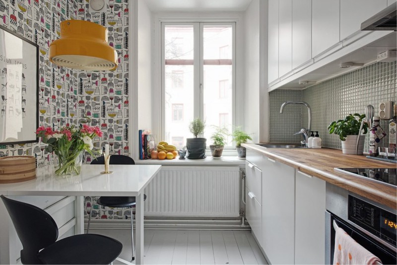 Kitchen with wallpaper on the same wall