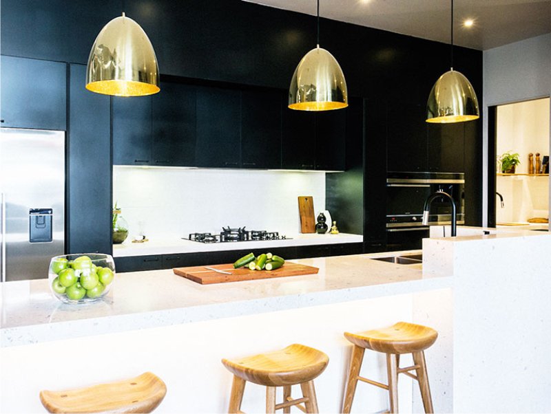 Lamps of gold color in the kitchen interior. Jpg