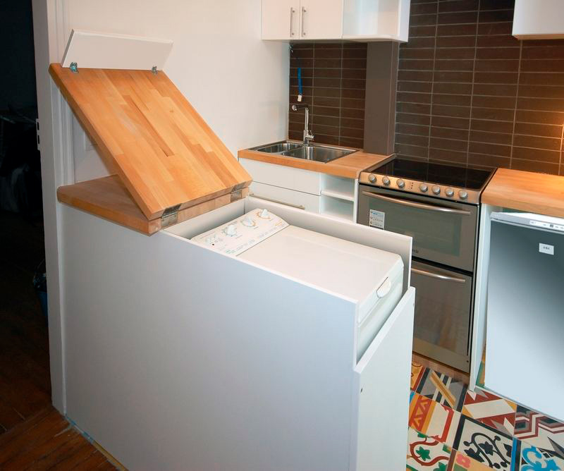 Vertical washing machine built into the bar counter