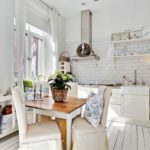 White curtains in the interior of the white kitchen