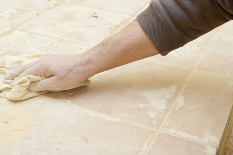 Remove excess floor tile grout