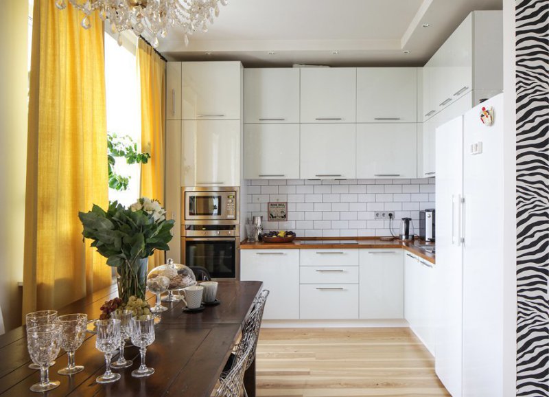 Yellow curtains in the interior of the kitchen