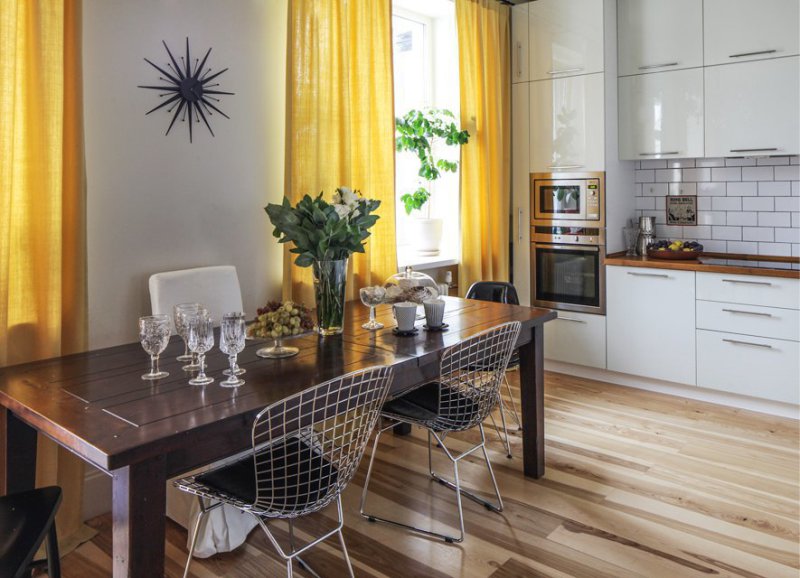 Yellow curtains in the interior of the kitchen