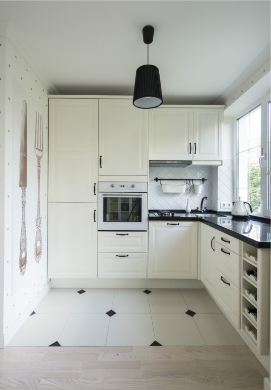 White wallpaper in the interior of a small kitchen