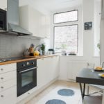 Apron from non-standard rectangular tiles in a modern kitchen interior