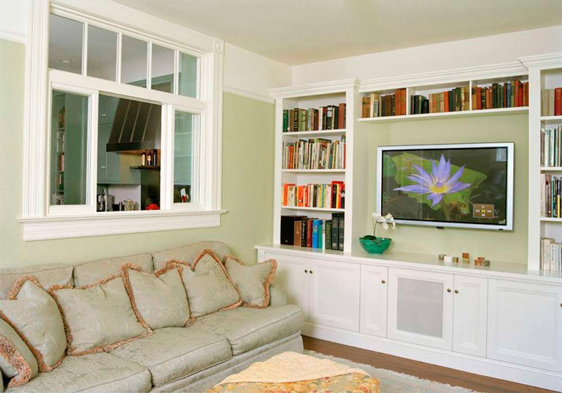 Living room with a window to the kitchen