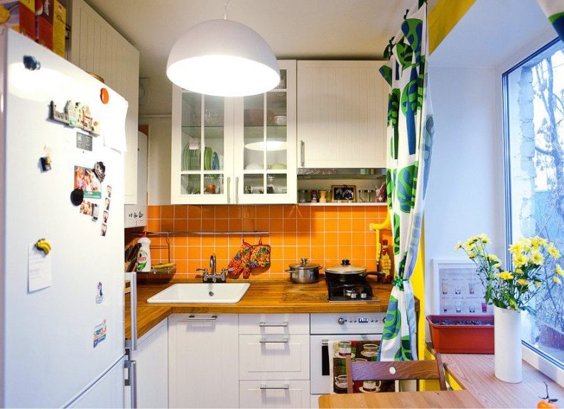 Interior of modern kitchen with wooden countertop