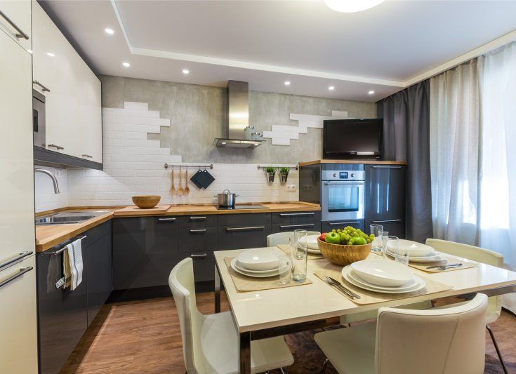 Interior of modern kitchen with wooden countertop