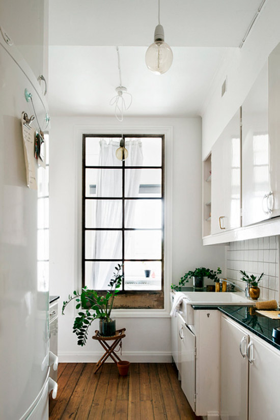 Kitchen with an interior window in the bathroom