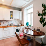 Kitchen apron in patchwork style in the kitchen with wooden countertop