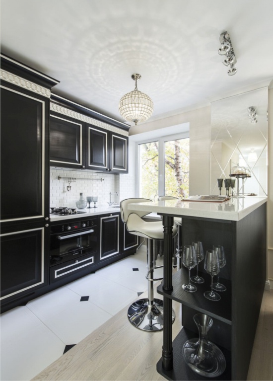 Built-in refrigerator in the interior of a classic kitchen