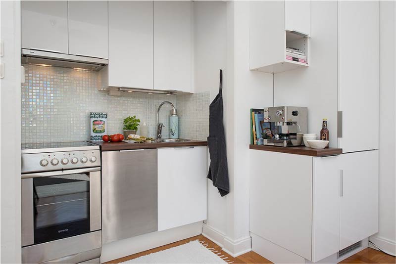 Built-in refrigerator in the interior of a small kitchen