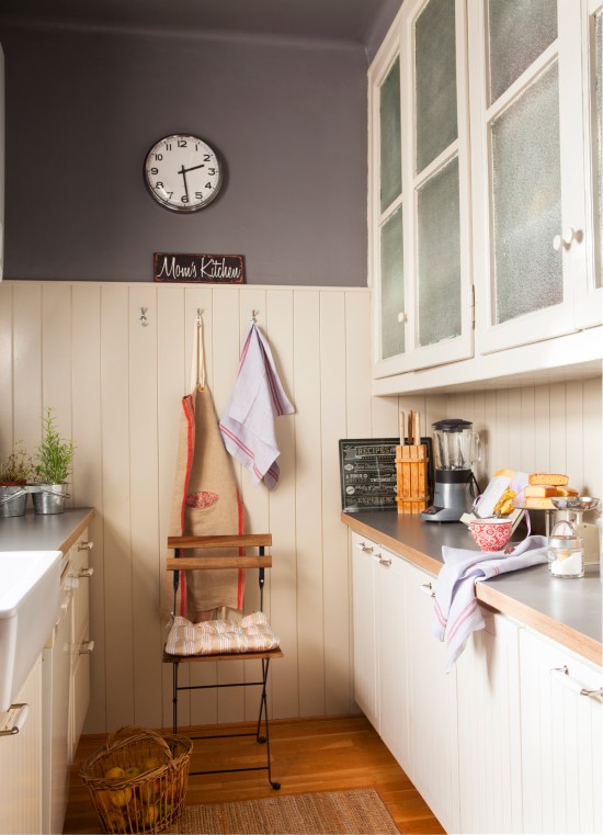 The blank wall of a two-row kitchen