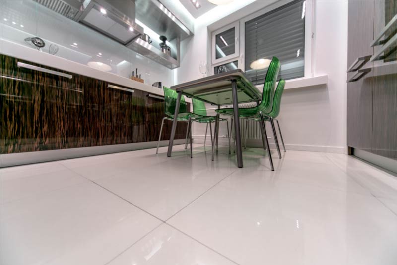 Kitchen with a parallel layout and a table in the center.