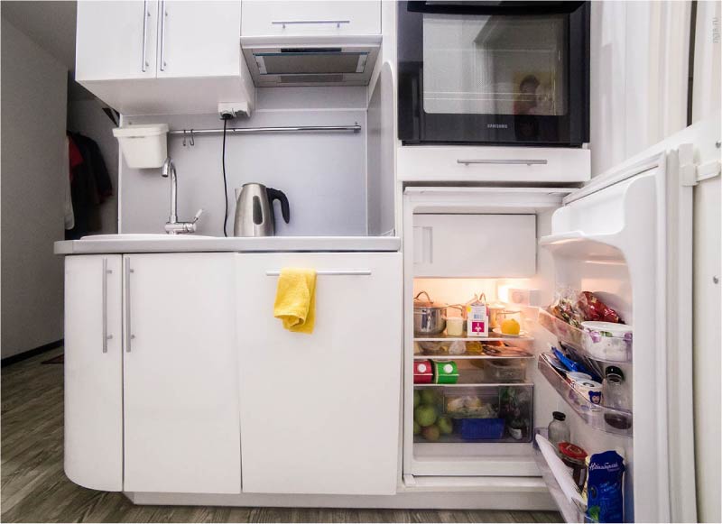 Built-in mini-fridge in the interior of the direct kitchen