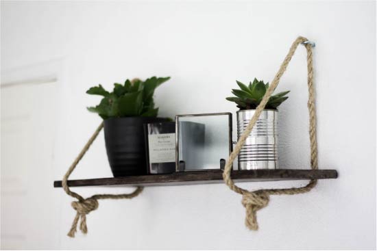 Shelf of wooden boards and ropes