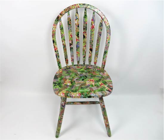 Full decoupage of the chair with small pieces of paper