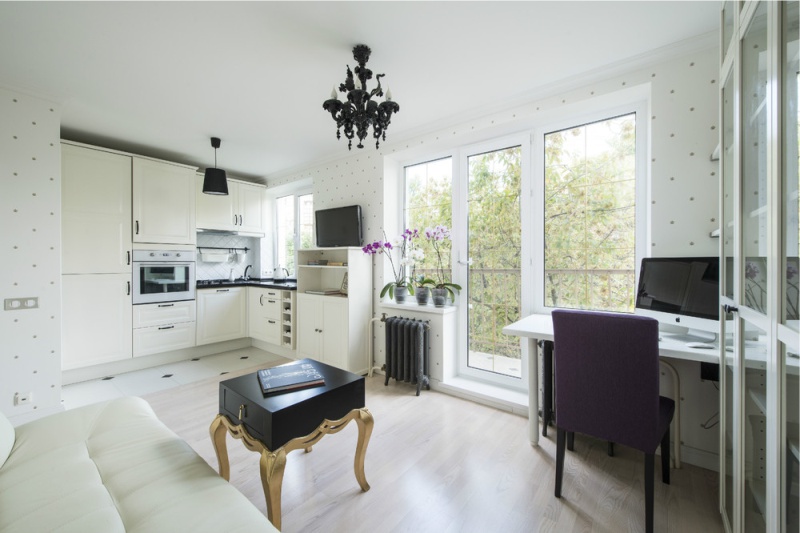 Balcony unit without curtains in the kitchen-living room in Khrushchev