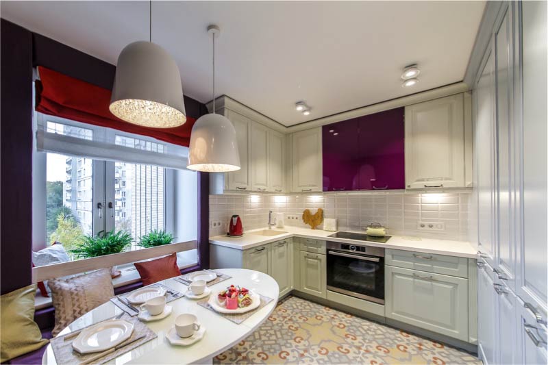 Kitchen interior with a built-in refrigerator in the cabinet unit