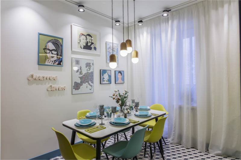 Interior of modern kitchen with balcony and white curtains