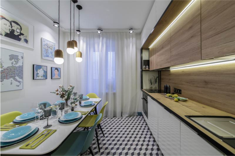 Interior of modern kitchen with balcony and white curtains