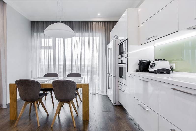 Modern kitchen interior with a balcony