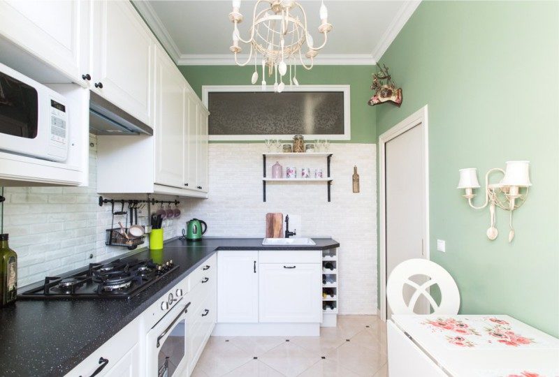 Kitchen with light green walls