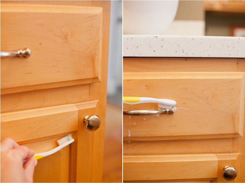 Cleaning the wooden kitchen with a toothbrush