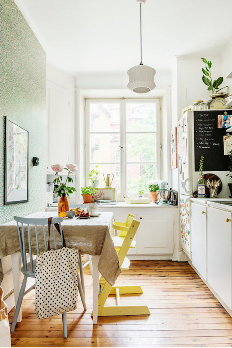 White kitchen with yellow wallpaper