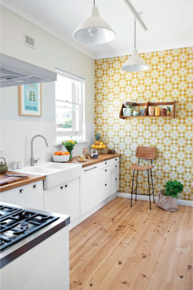 White kitchen with yellow wallpaper