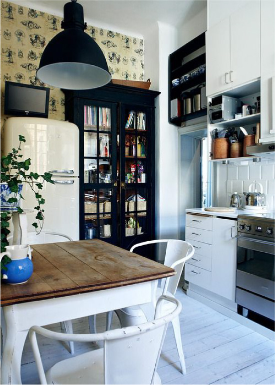 Black furniture and yellow wallpaper in the interior of the kitchen