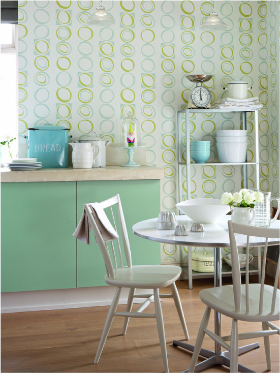 Green kitchen with beige wallpaper