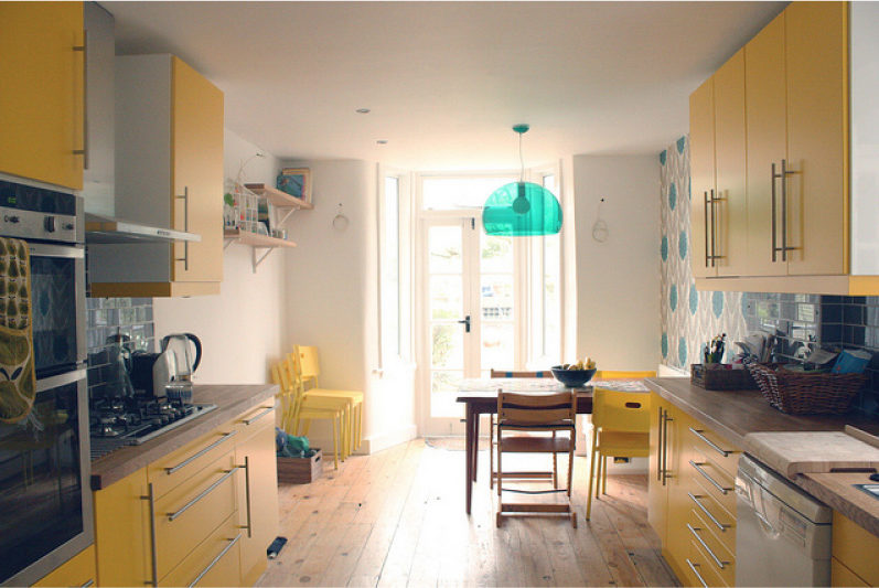 Yellow kitchen with gray-blue wallpaper