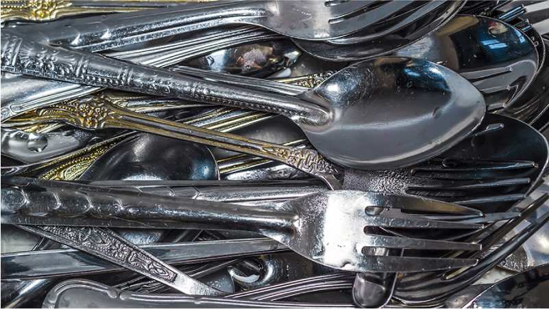 Dirty stainless steel cutlery