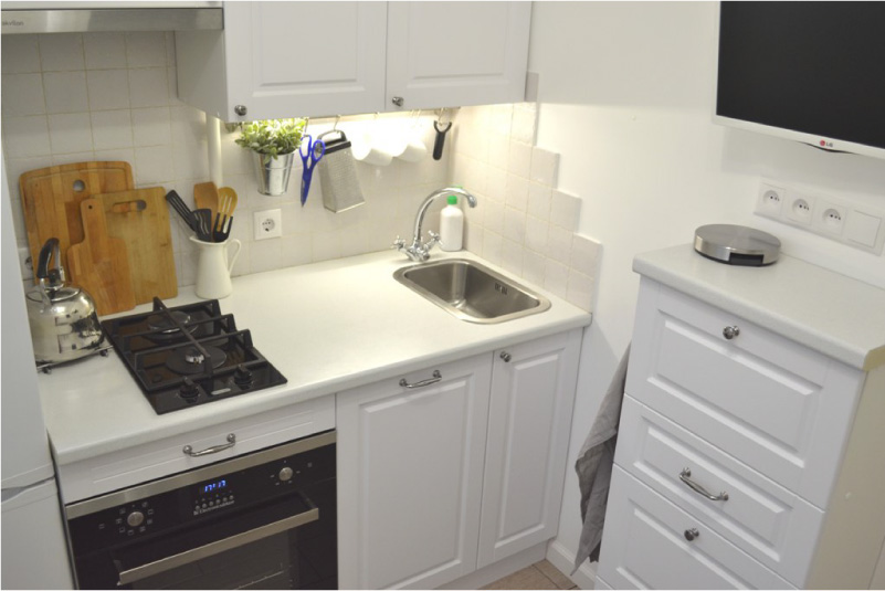 Rails in the interior of a very small kitchen