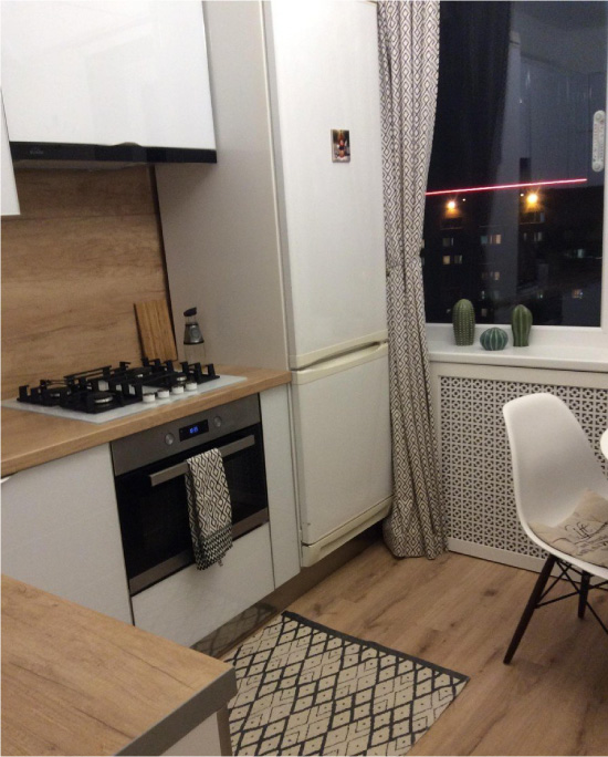 Kitchen with refrigerator next to the gas stove in Khrushchev