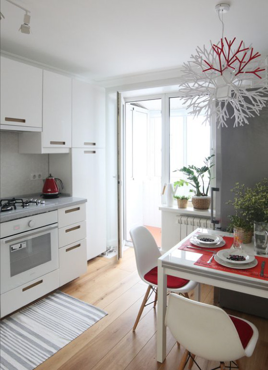 Built-in refrigerator next to the gas stove at a distance of 40 cm