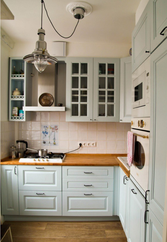 Blue kitchen with wooden countertop