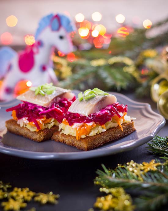 Herring under a fur coat on toasts