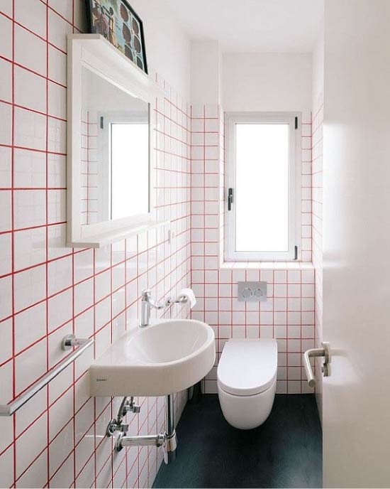 Red seams and white tile in the restroom