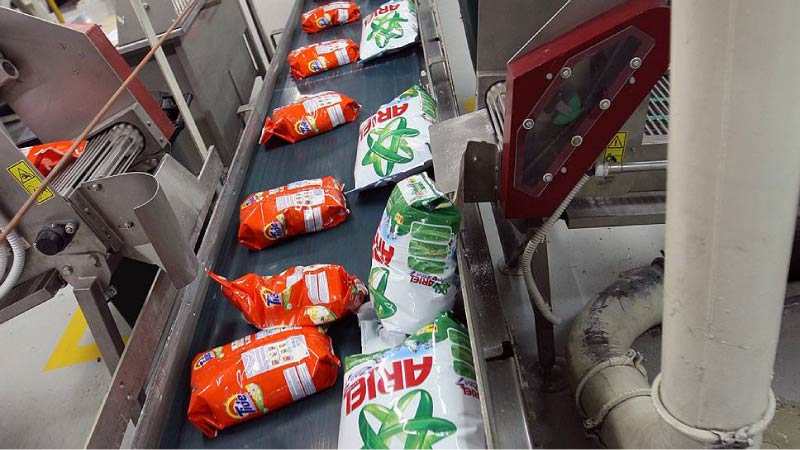 Tide and ariel powders on conveyor